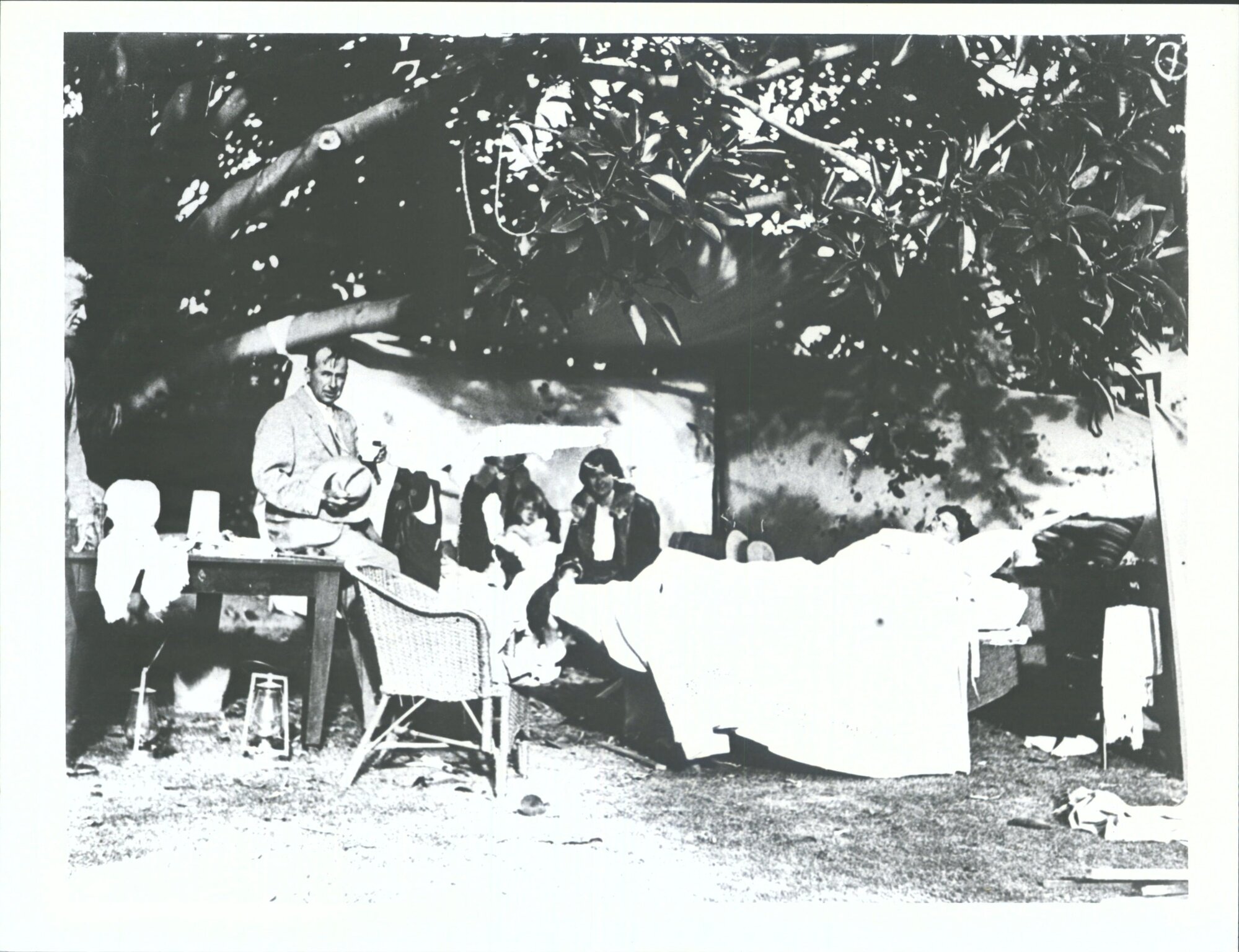 In a temporary dressing station Dr Gerald Patrick Fitzgerald sitting on table