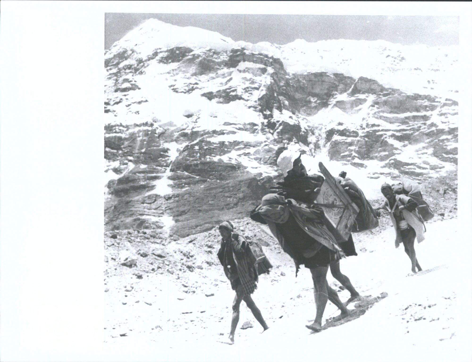 "Jim McFarlane, a member of the N.Z.H.E. was involved in an accident in a crevasse at the head of the Barun Glacier. This pictur