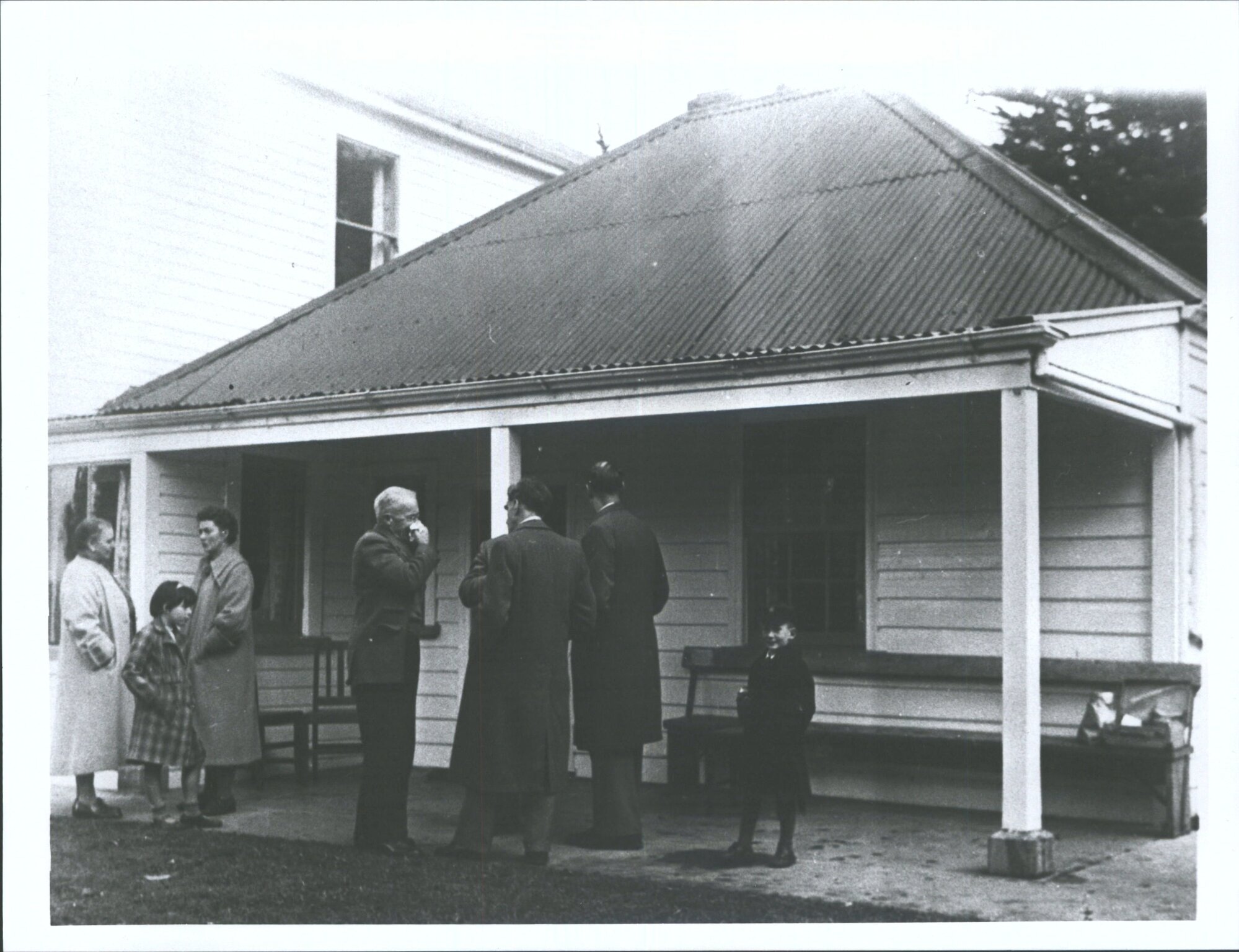 "This is an (unidentified) outing of the Historic Places Trust members, probably in the 1960's, The man blowing his nose is H. D