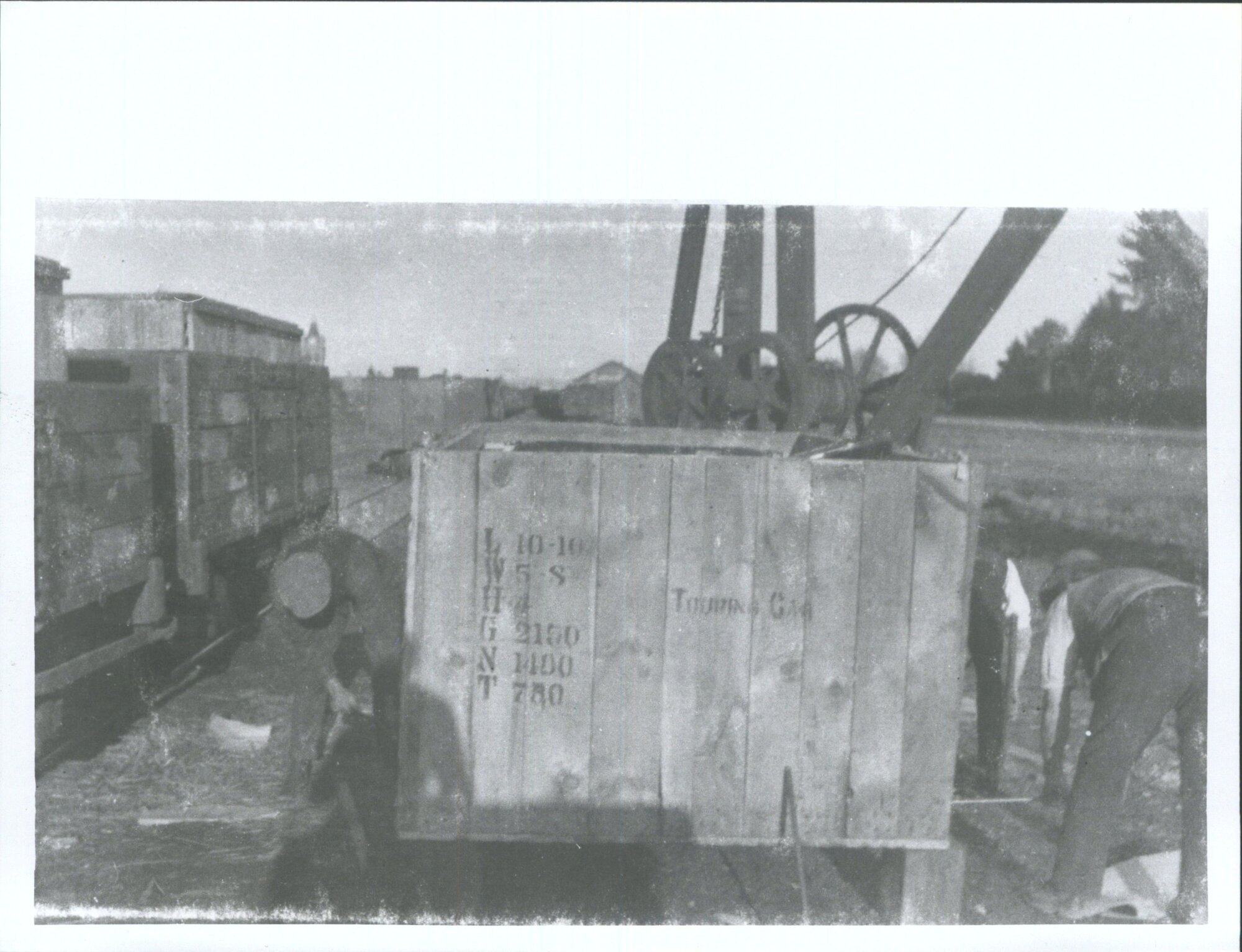"Unloading Ford cars in cases at Ashburton Railway Station