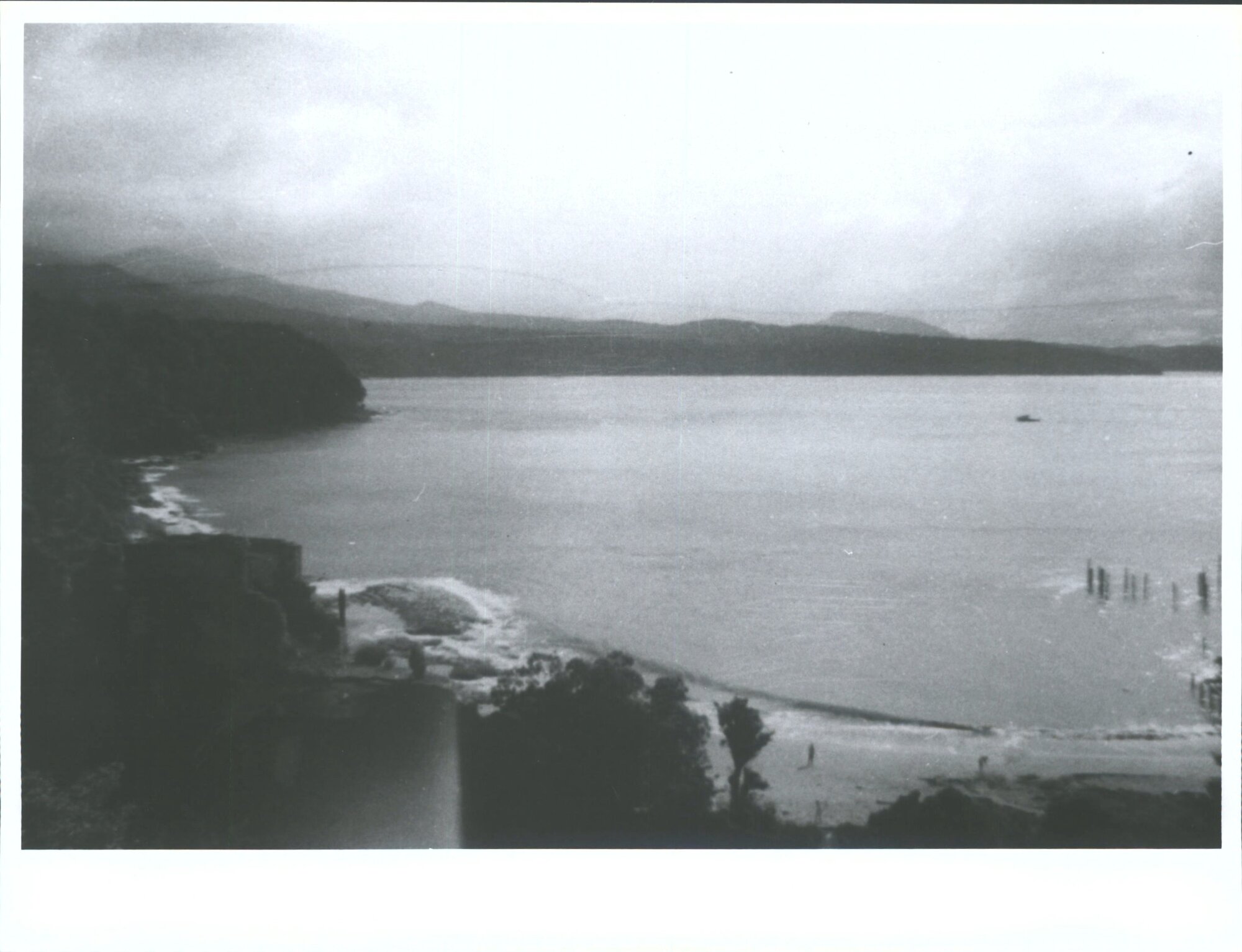 The Port with Concrete foundations of Sawmill [?] on left and wharf piles on right
