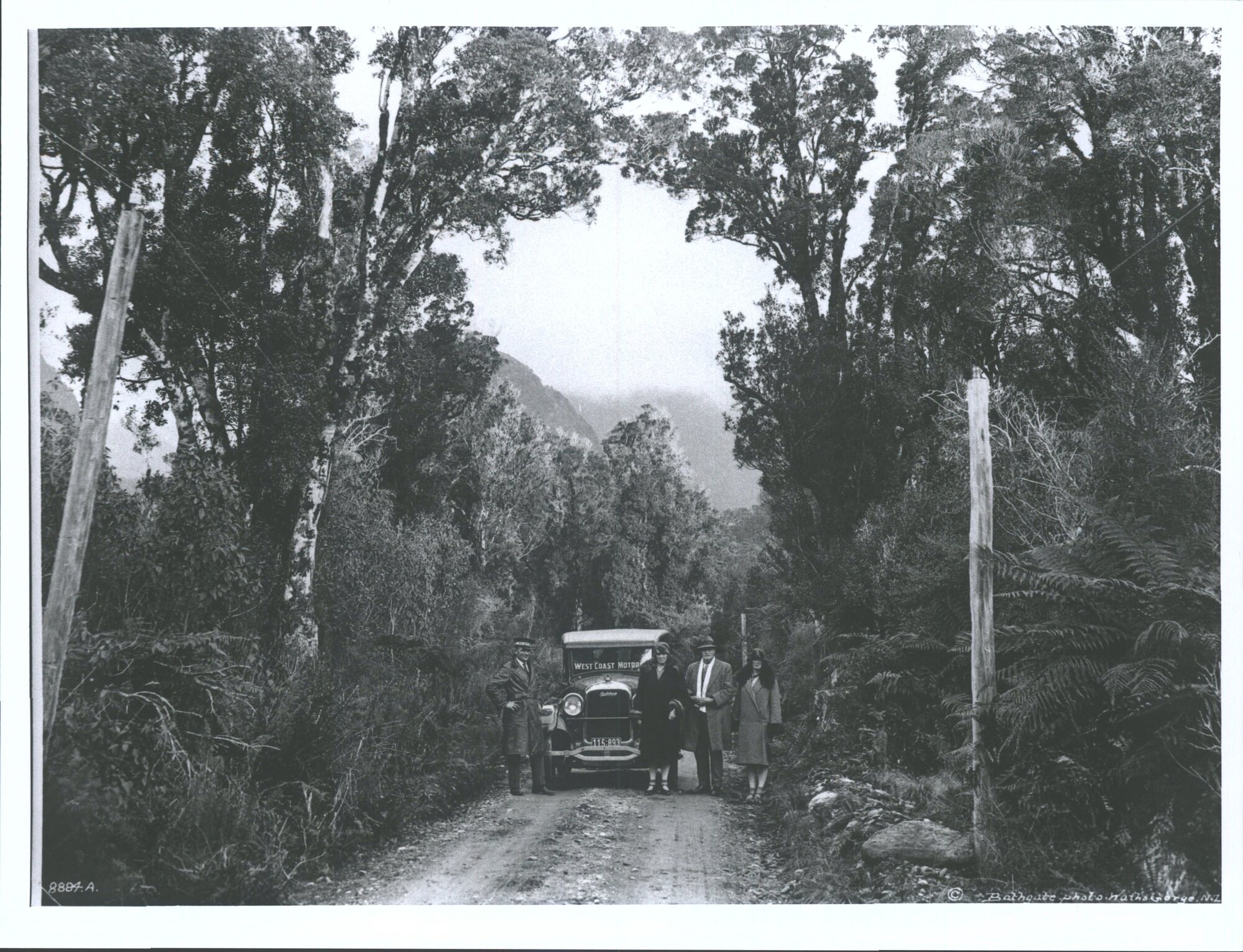 Unidentified group with car on Waiho Gorge Road