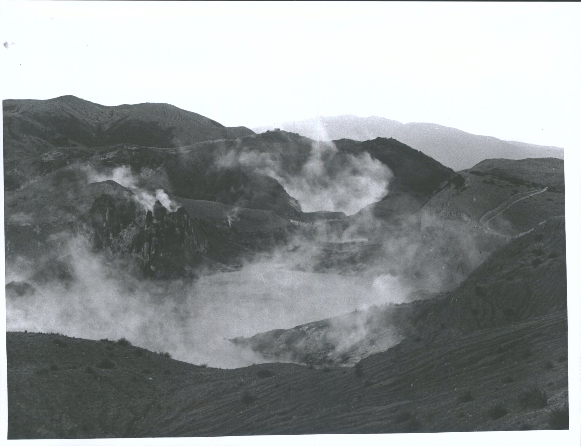 The site of the Waimangu Geyser with Black Crater, and Mt Tarawera in the distance