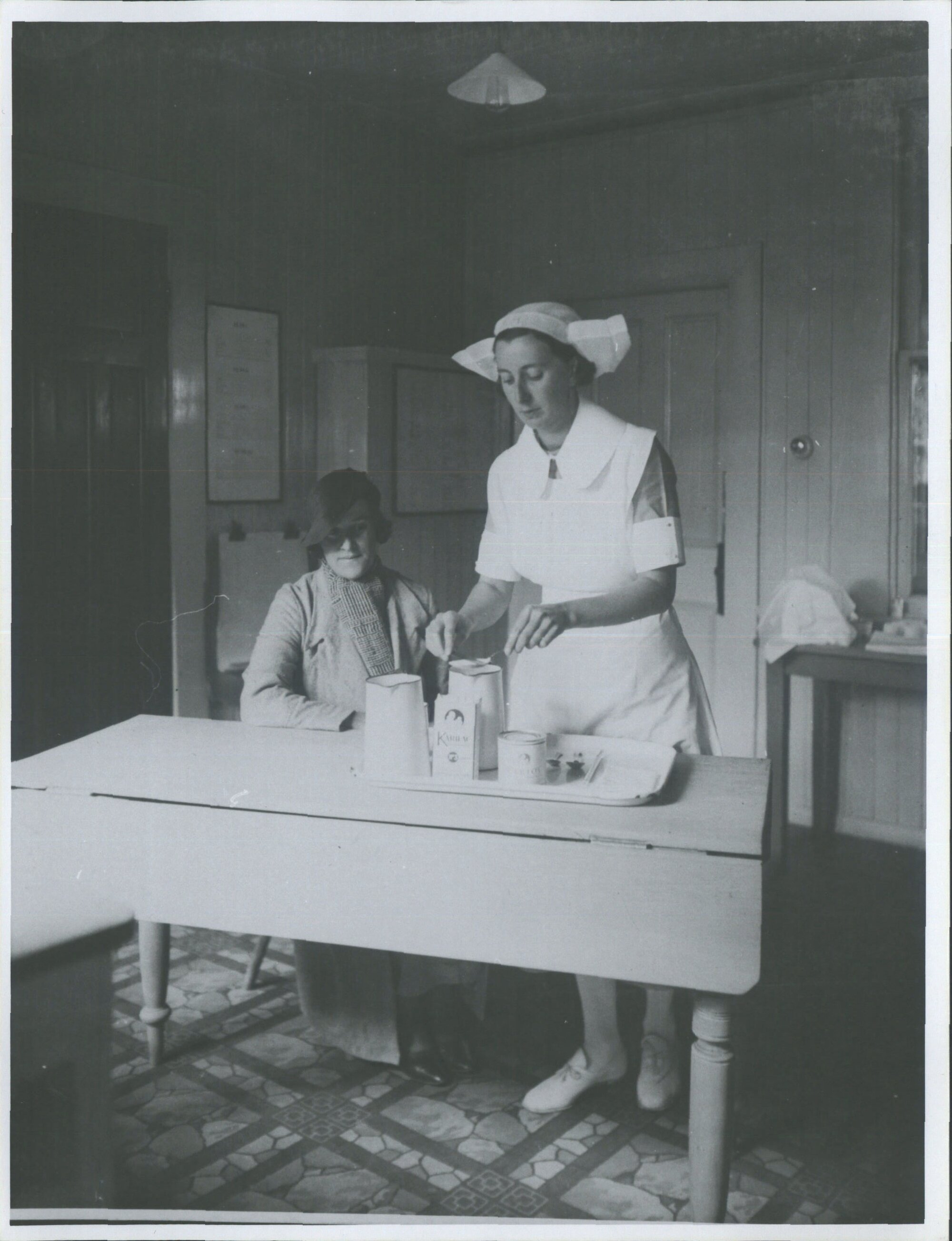 Nurse demonstrating preparation of artificial food for baby