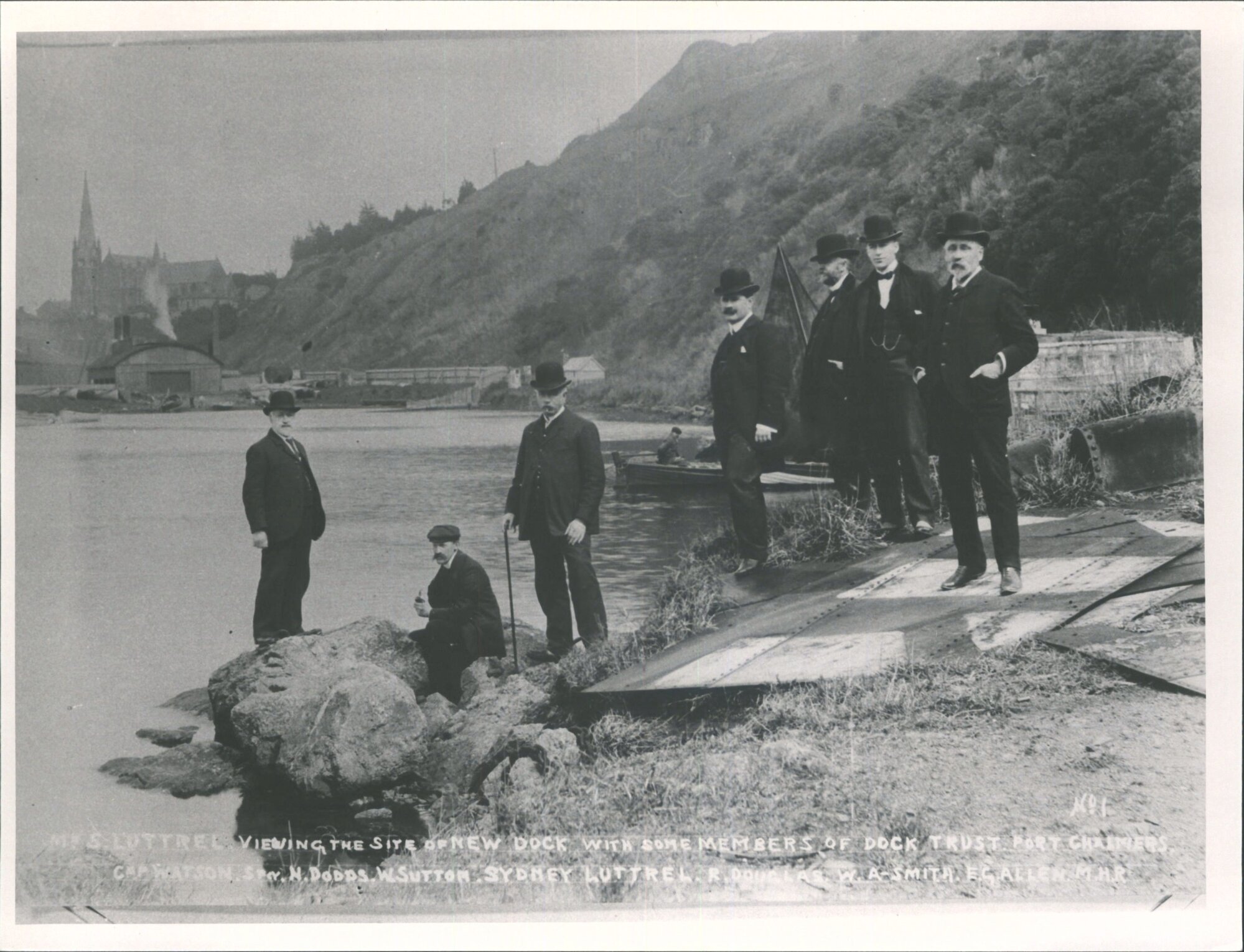 Mr S Luttrel viewing the site of new dock with some members of dock trust. Port Chalmers.