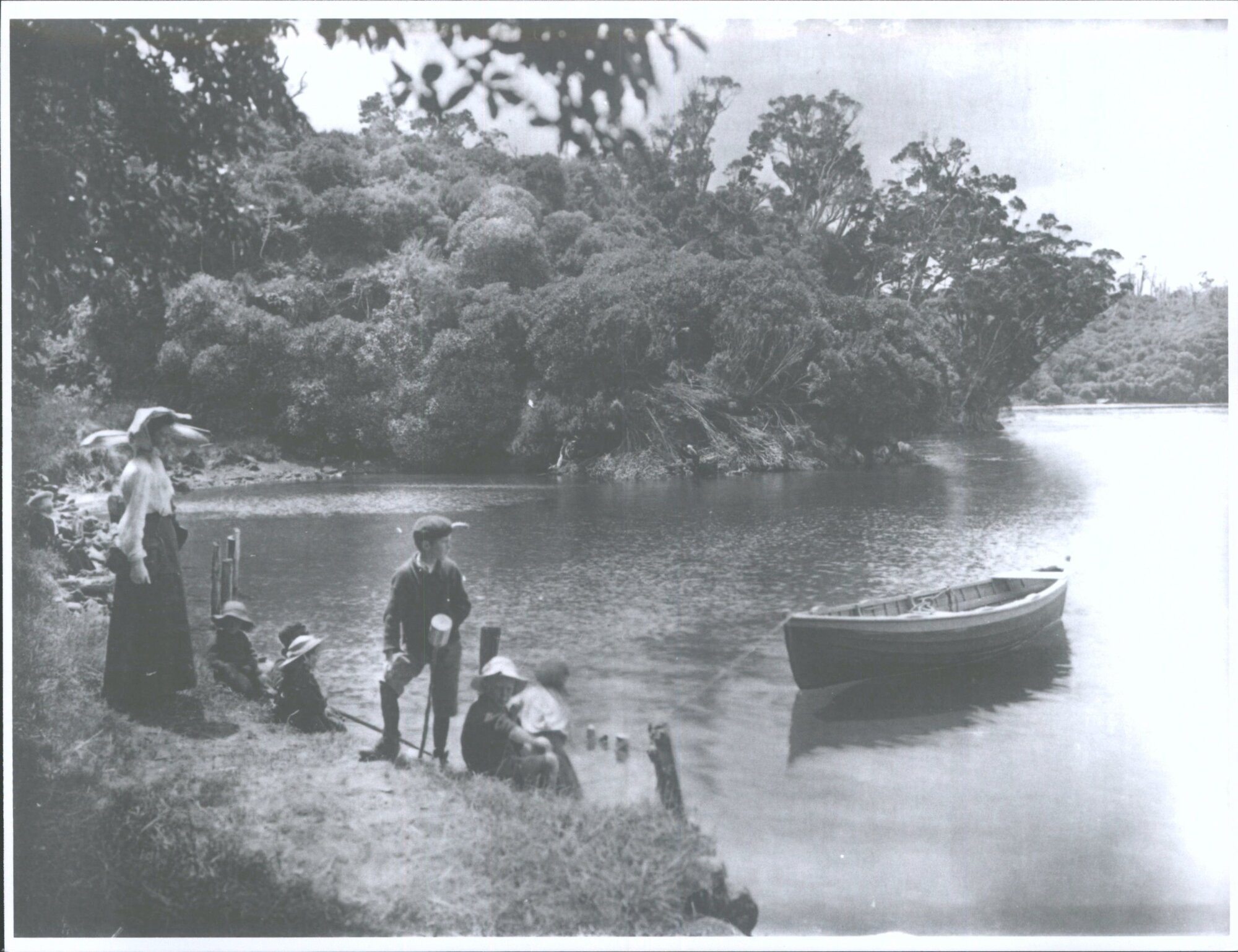 Woman and Children on the verge of a bay