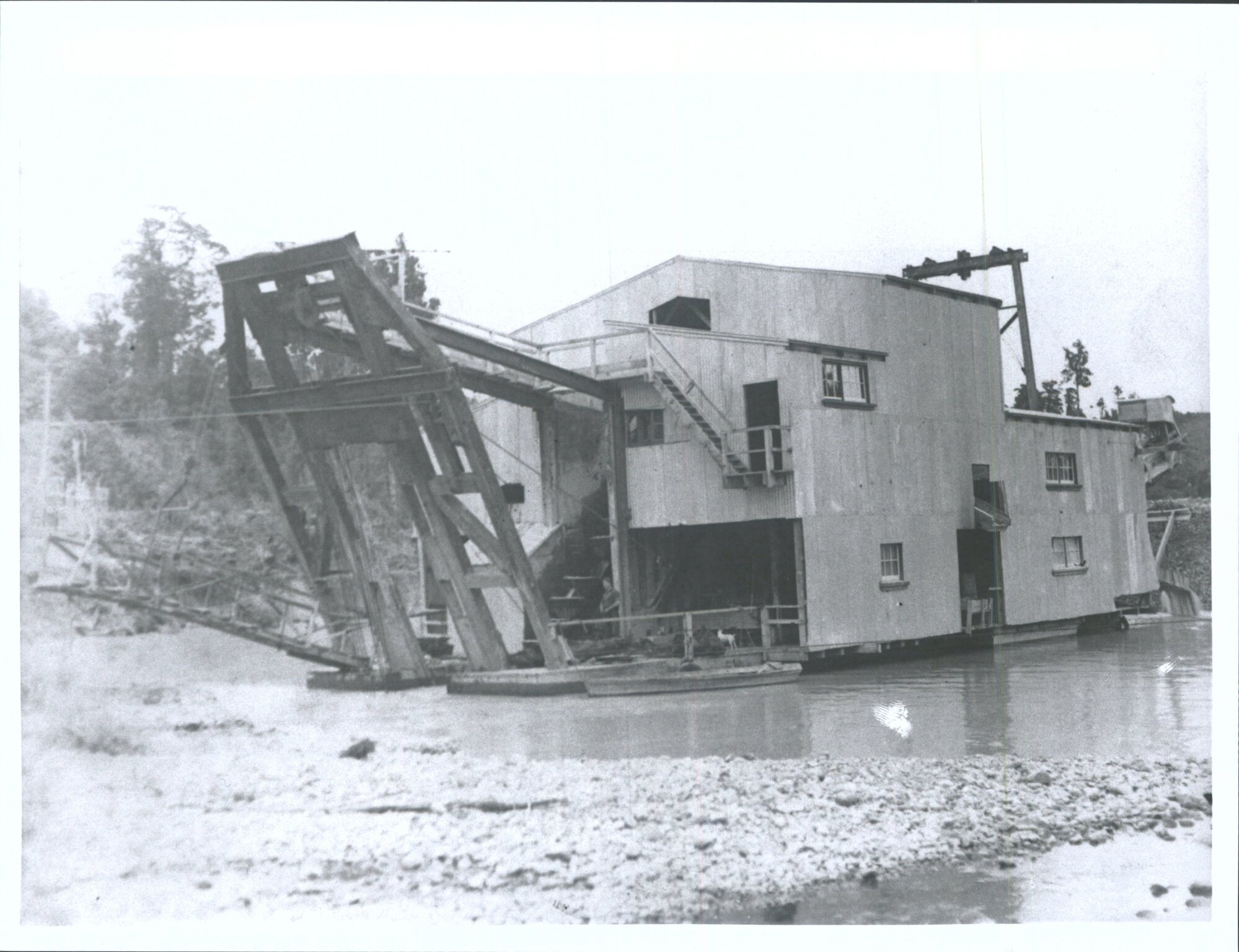 Man and dog on dredge at New River