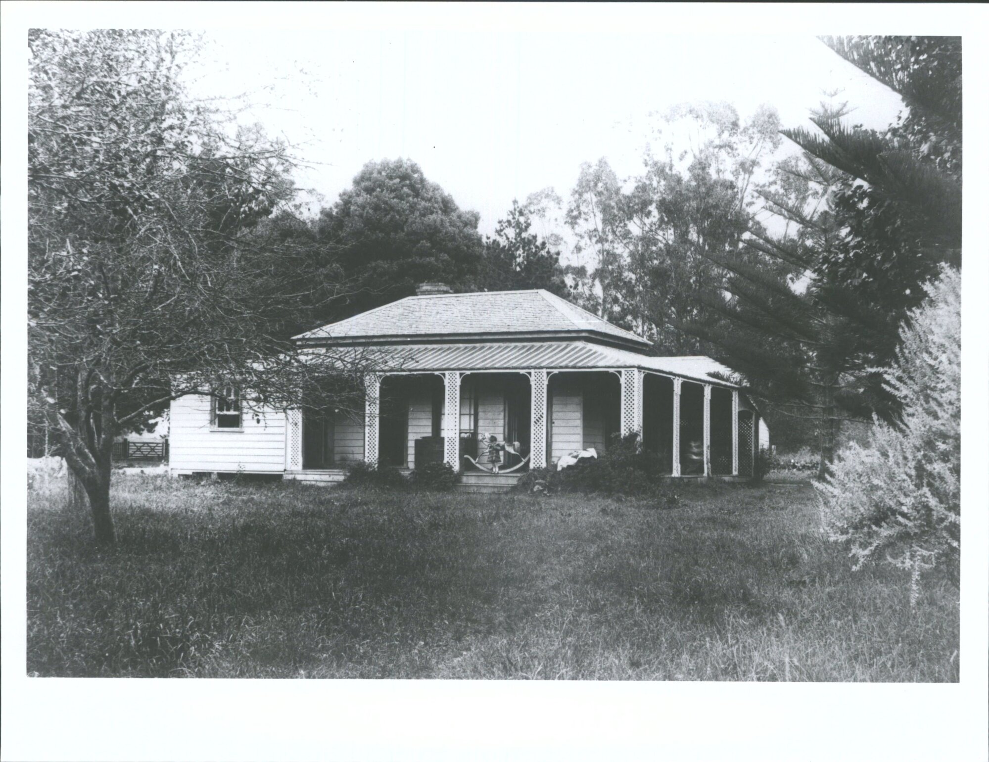Family homestead at Otahuhu with R. B. W. in front of rocking horse