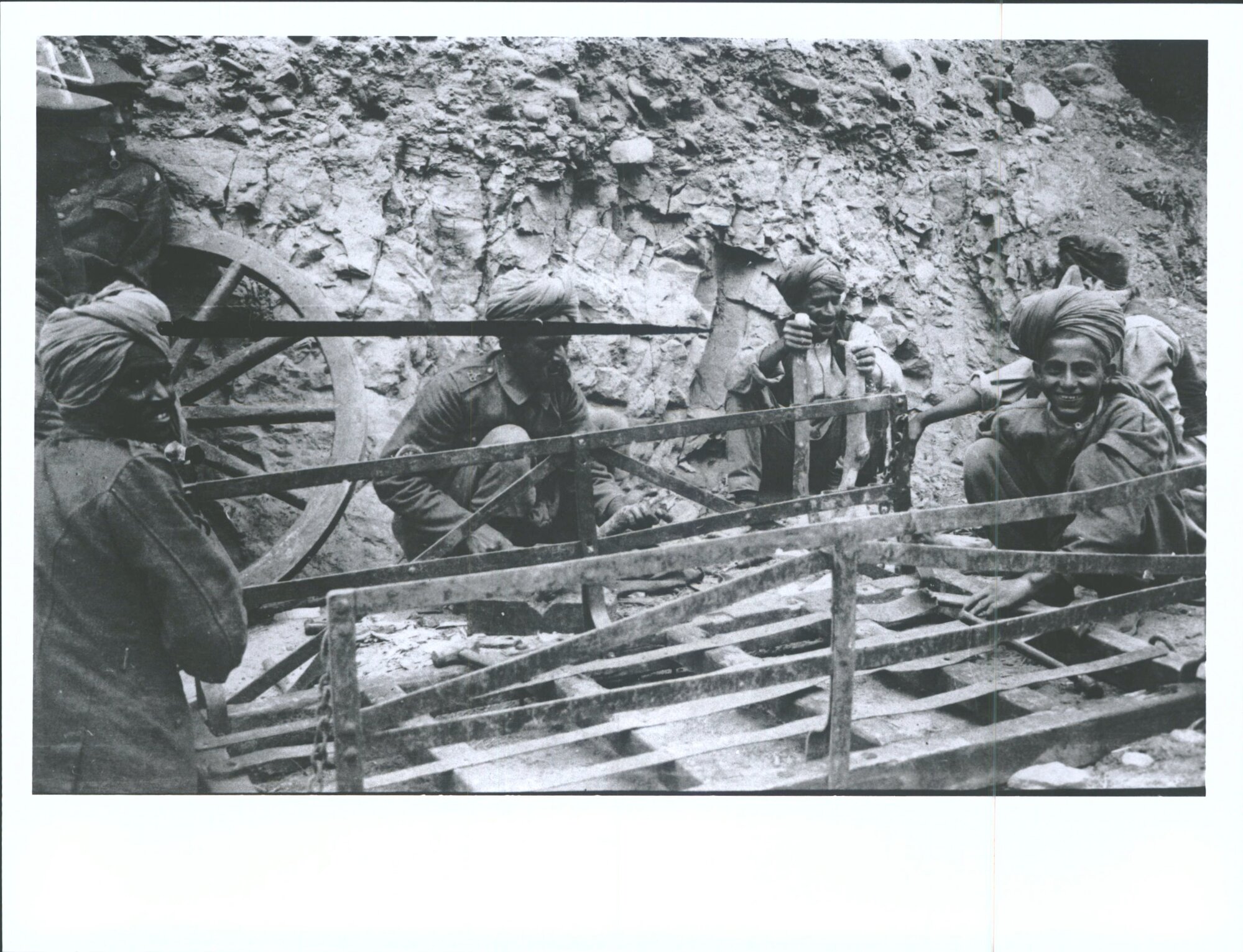 "Indian wheelwright at work"