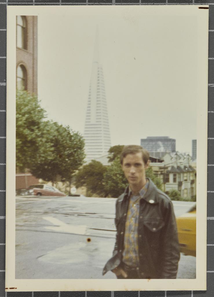 Man in front of transatlantic tower