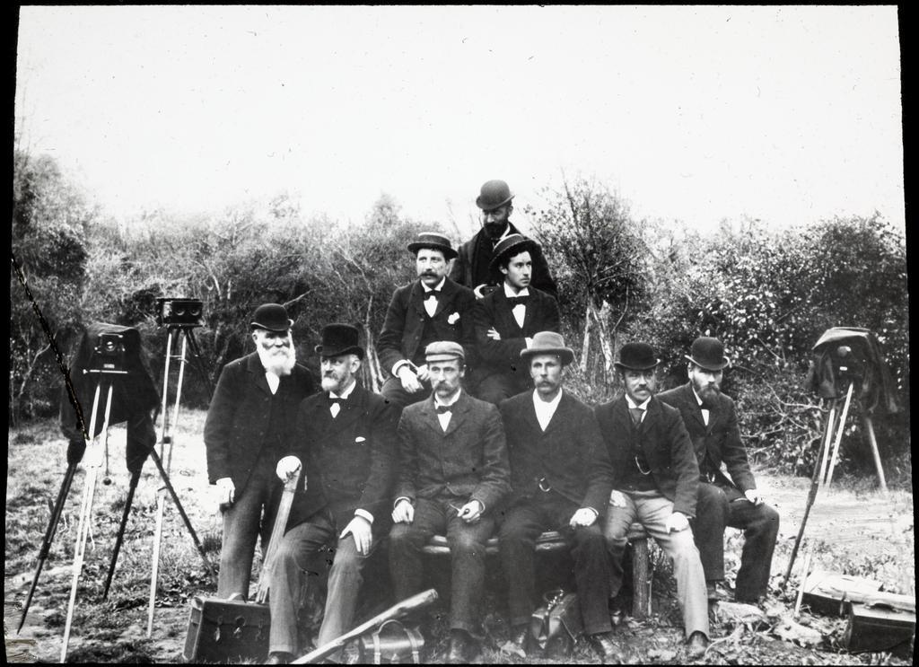 Group of men with cameras and photographic equipment
