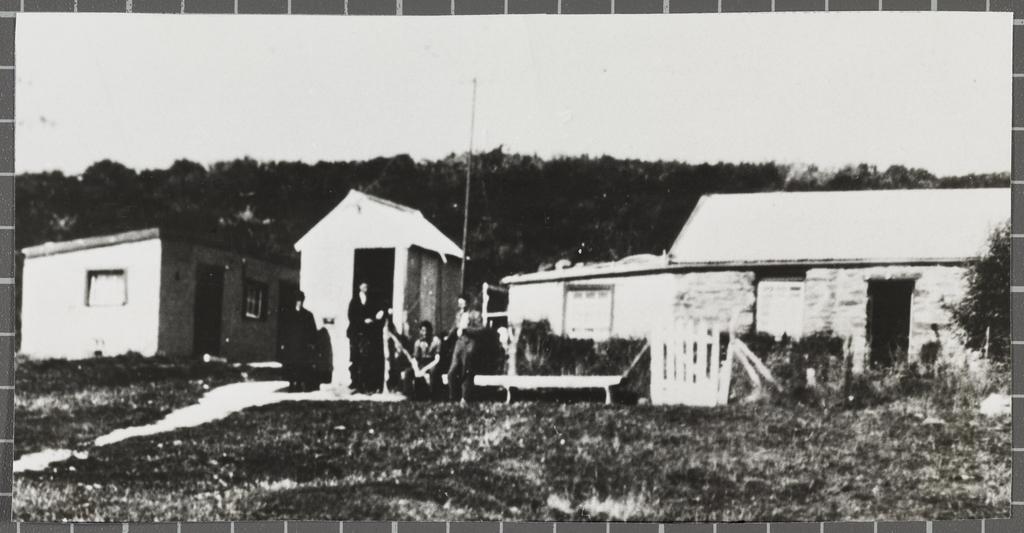 Two Swinney brothers and other unidentified people outside the post office, Cambrians