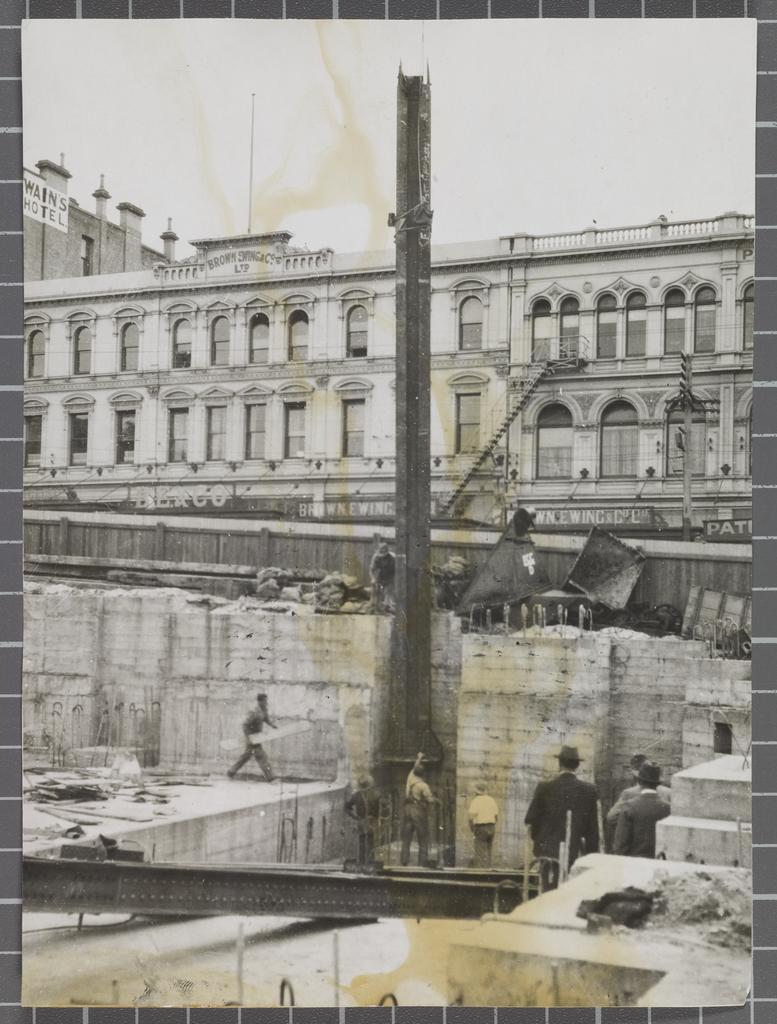 'G.P.O. [General Post Office] Dunedin Lowering first Stanchion into place 19.2.34'
