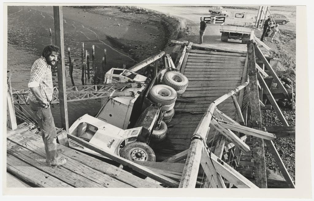 'Mr A. Paton-McDonald surveys his $20,000 mobile crane which fell into the Taieri River yesterday, when the Taieri Mouth bridge collapsed'