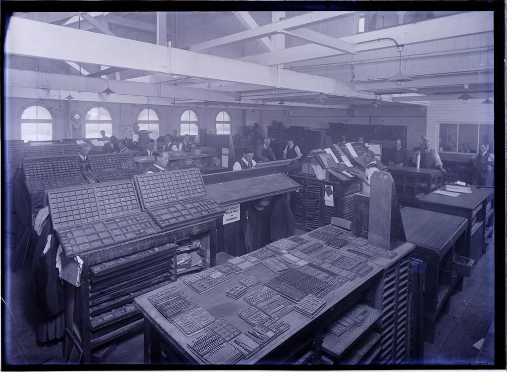 Men working with movable type and showing letterpress drawers, Coulls Somerville Wilkie, Crawford Street, Dunedin