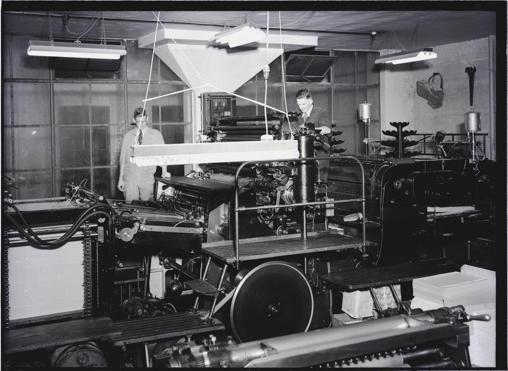 Two men and printing press, Coulls Somerville Wilkie, Crawford Street, Dunedin