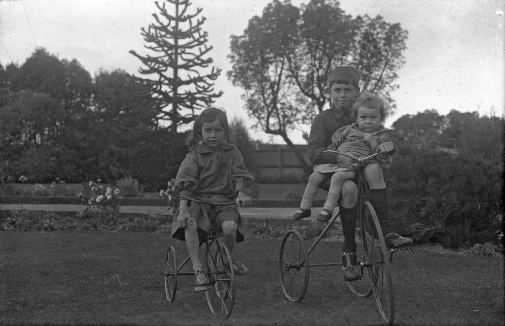 Alison McGeorge on bike, Fred on bike holding Vic