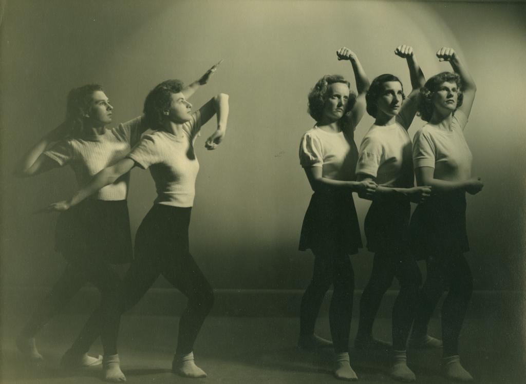 Five dancers, facing stage right