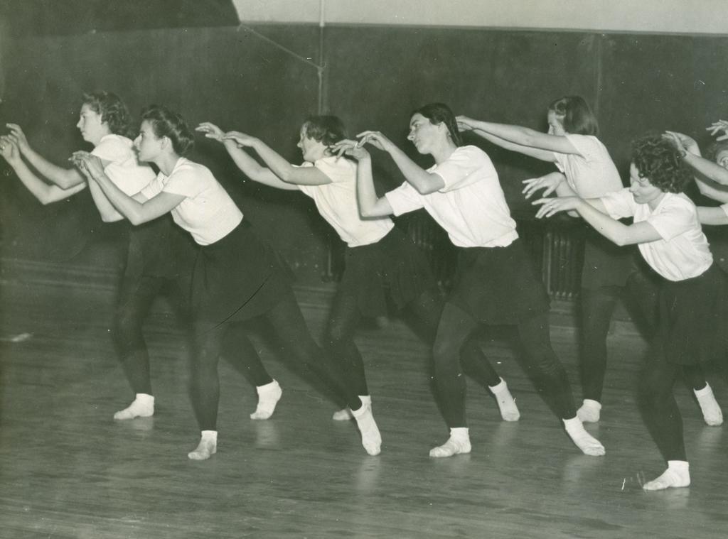 Six dancers, leaning over to left