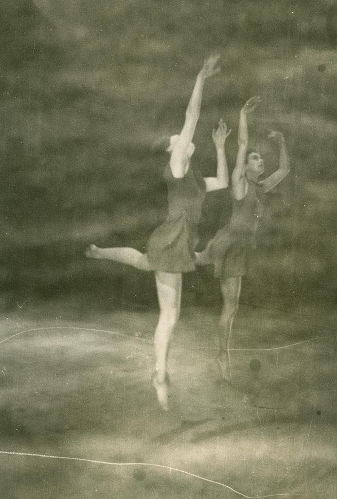 Two dancers facing right