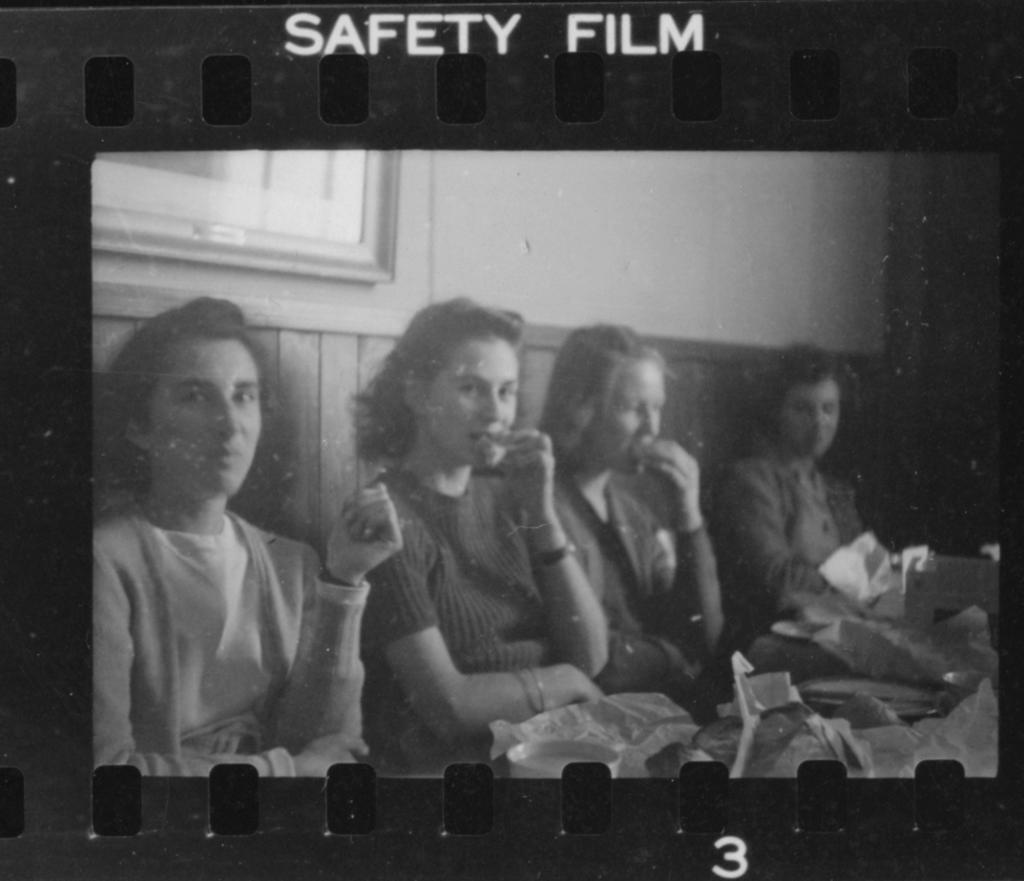 Four people sitting and eating