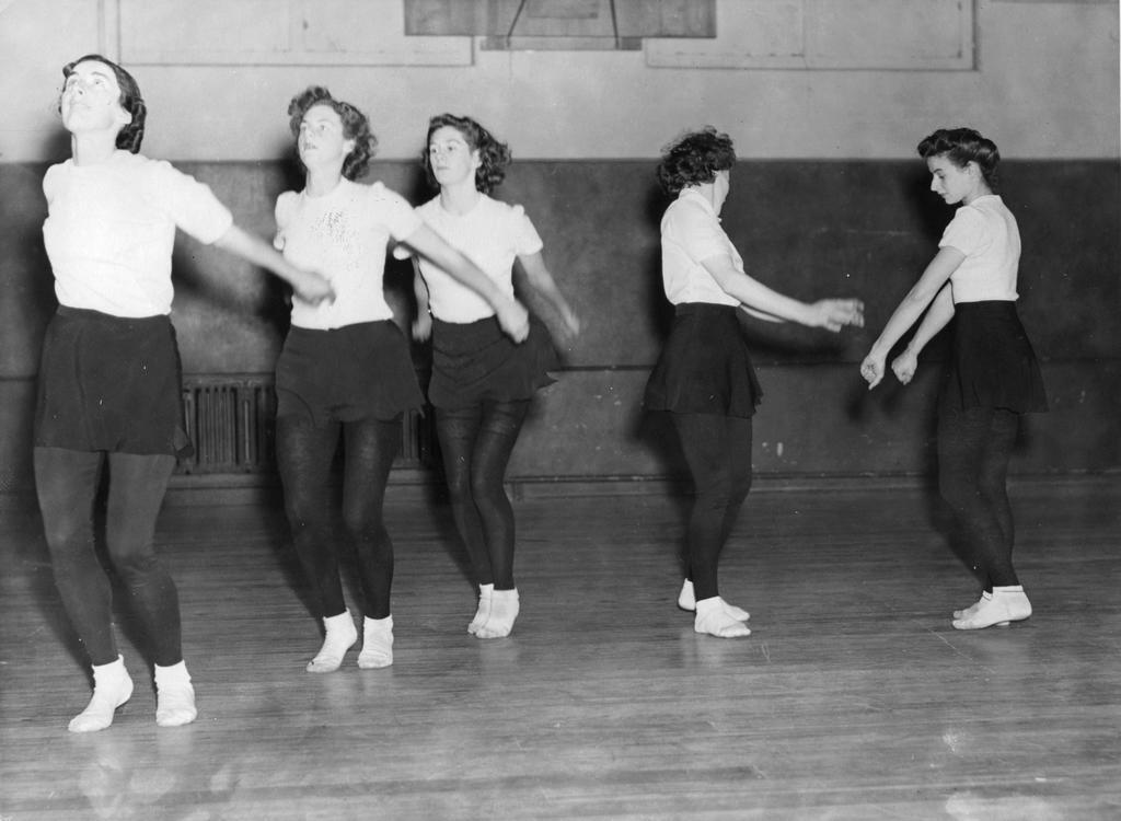 A group of three facing front/left and two facing each other