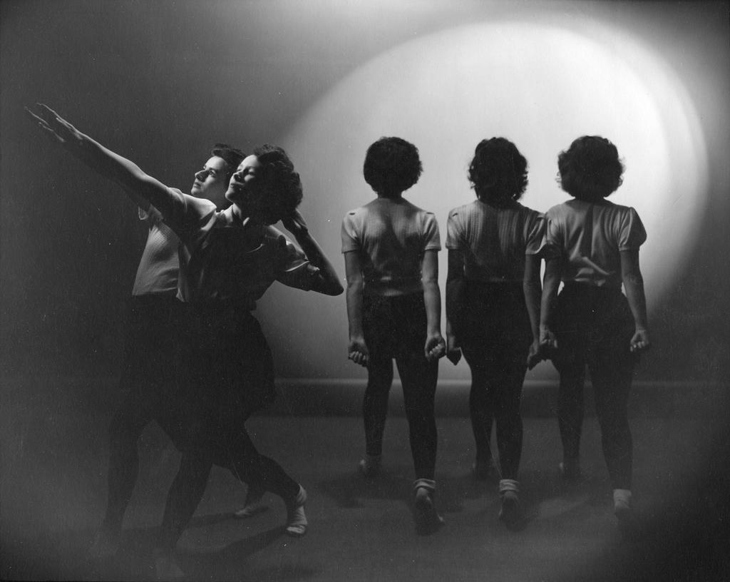 Dancers, two facing left and three facing away from camera