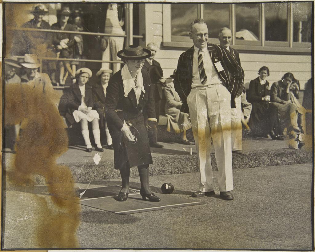 'Our opening day, 1938, Miss A.A. Greenslade patroness throwing the first kitty of the season', Caledonian Bowling Club