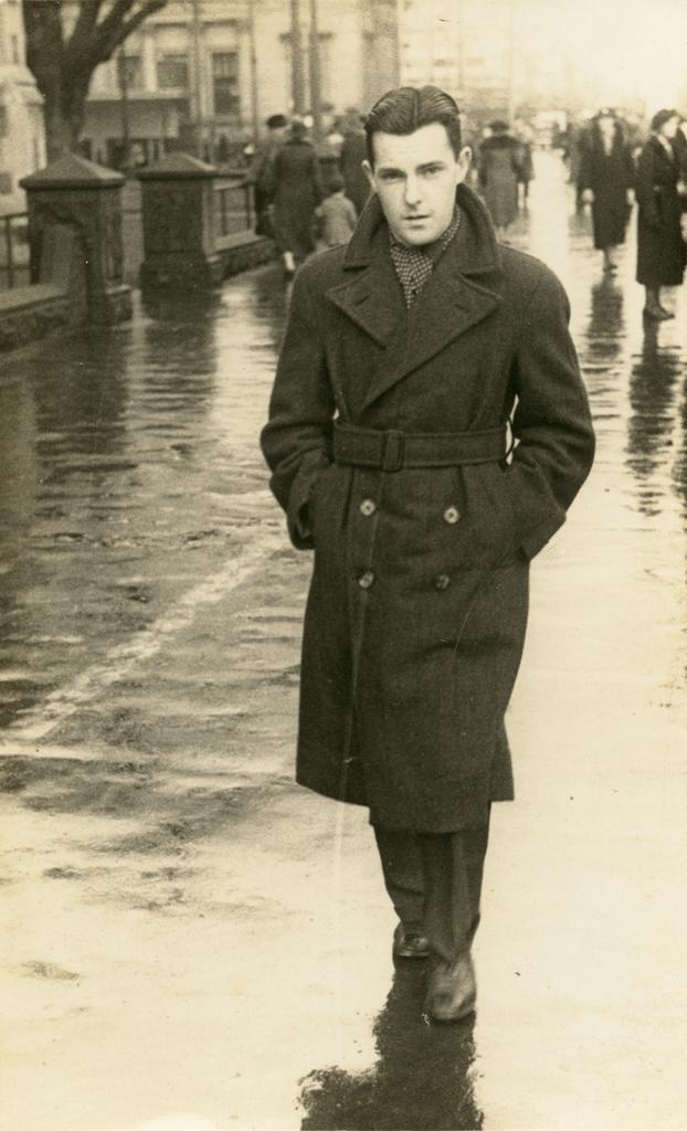 Keith Hulme standing on street in rain
