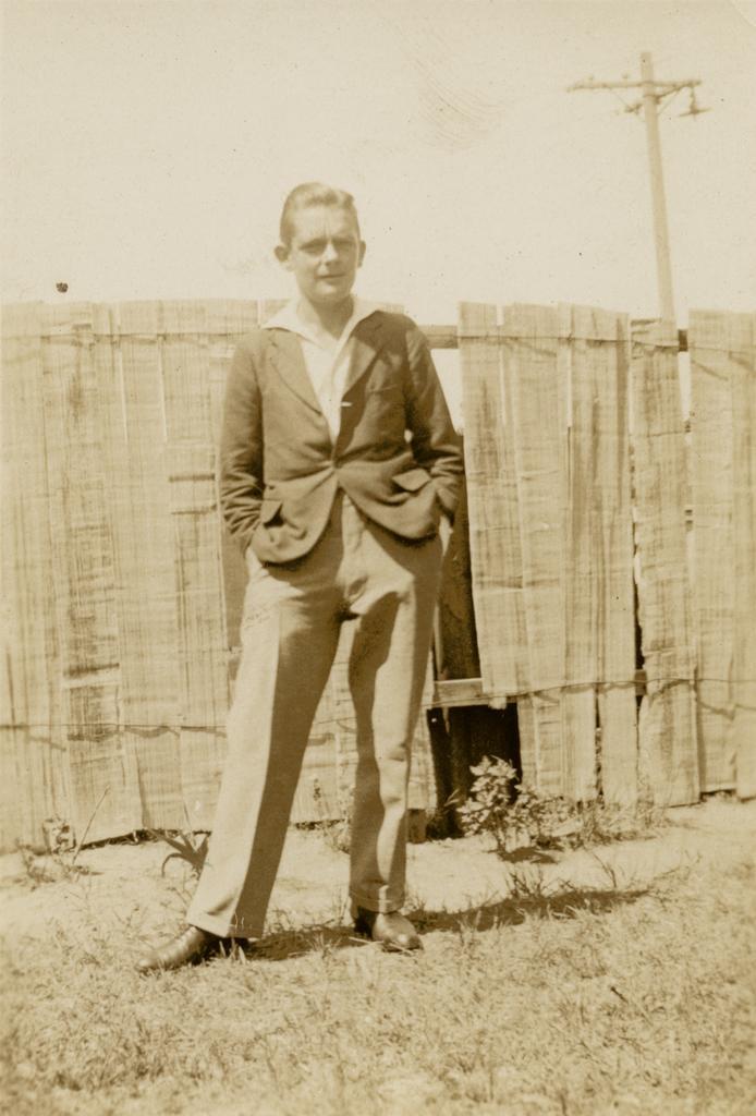 Standing in front of fence