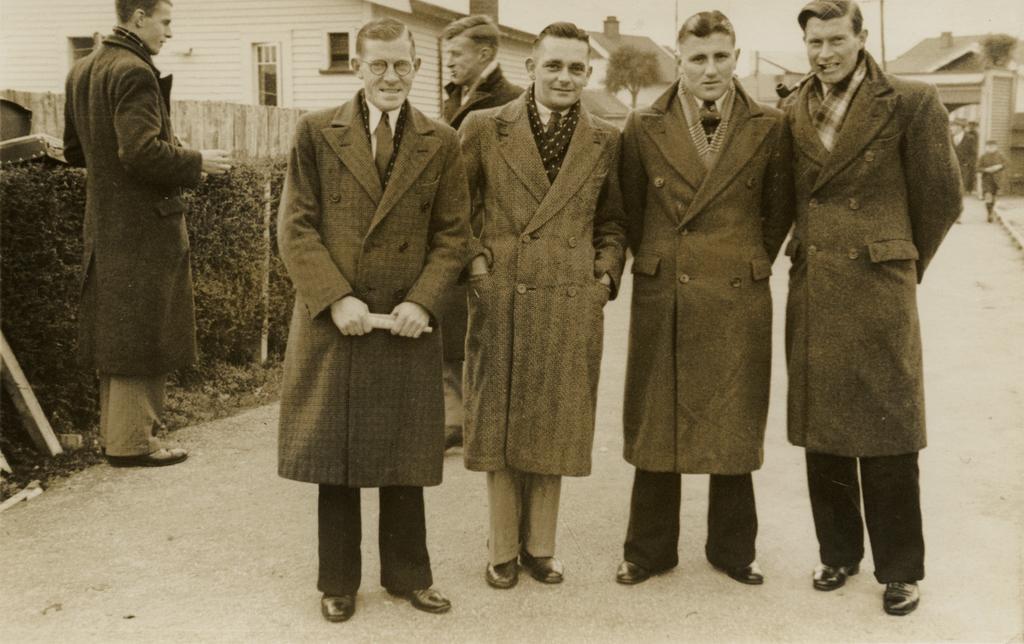 Four men in coats