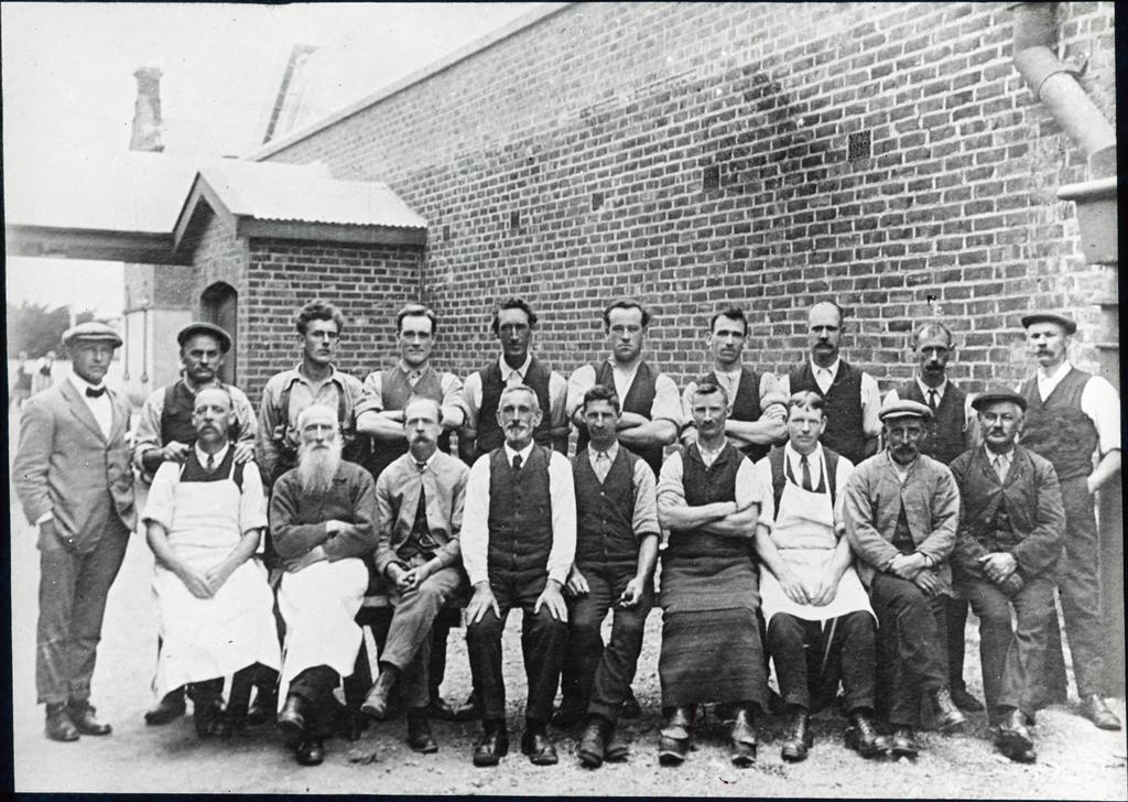 Workers in front of a brick building [Mosgiel Woollen Mills]