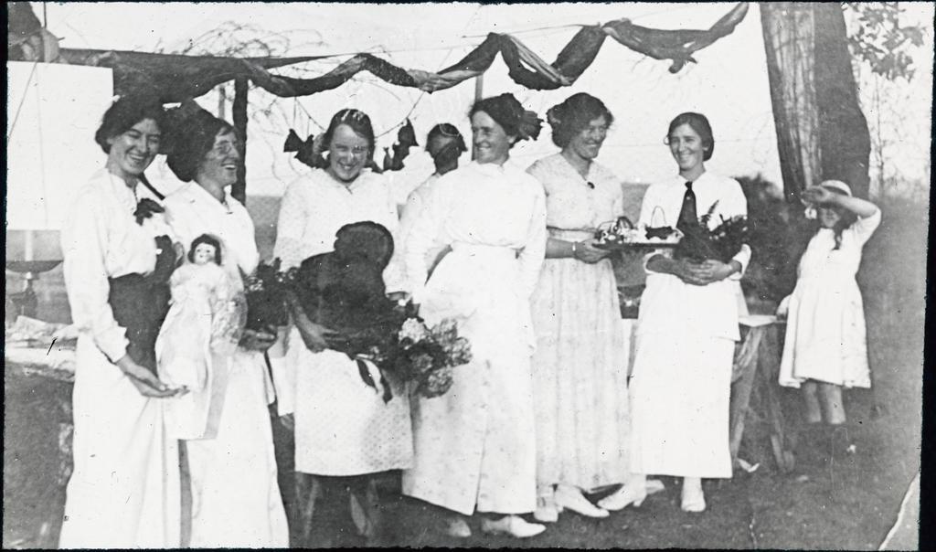 Group of young women at community fair or similar