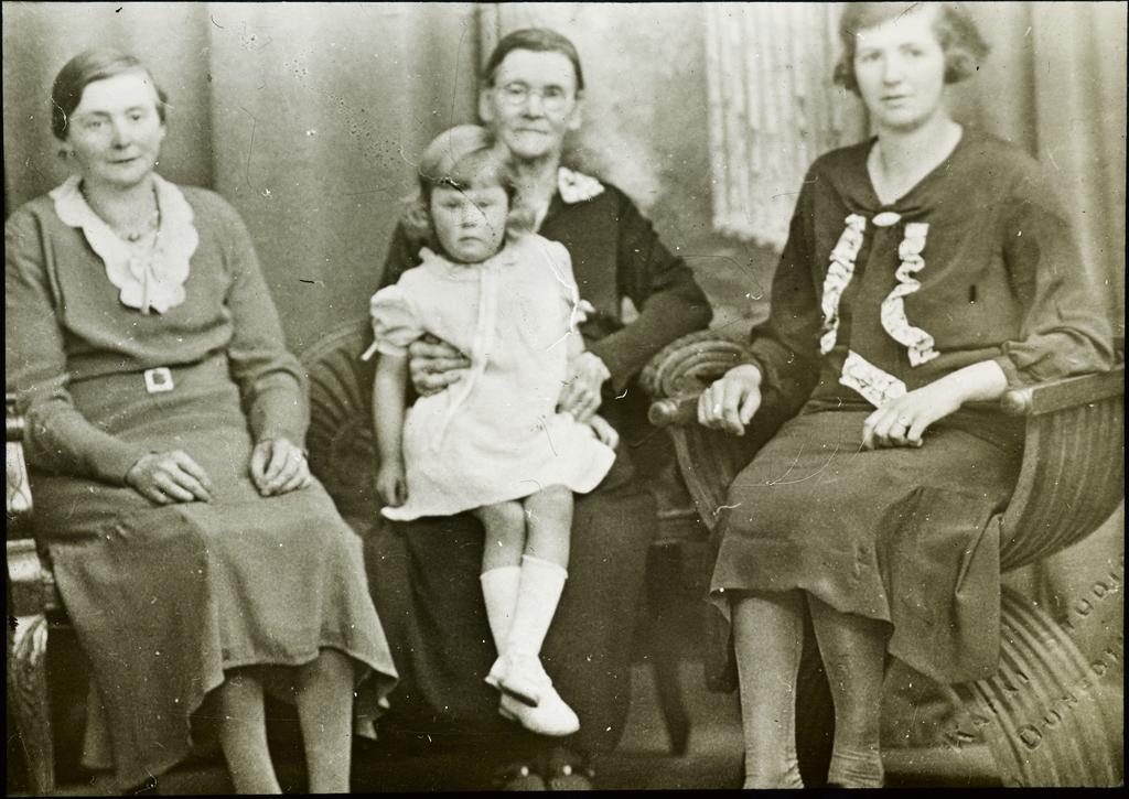 Three women and young child