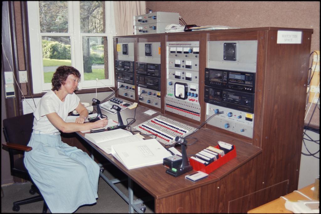 Elizabeth Purdie at Eihudie switchboard in audioconference control room