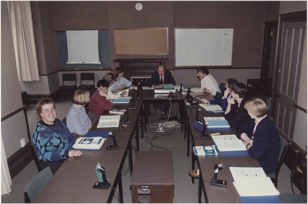 People using the University Extension conference room, 'Salmon (Jack) U.E. Teleconference Equipment'