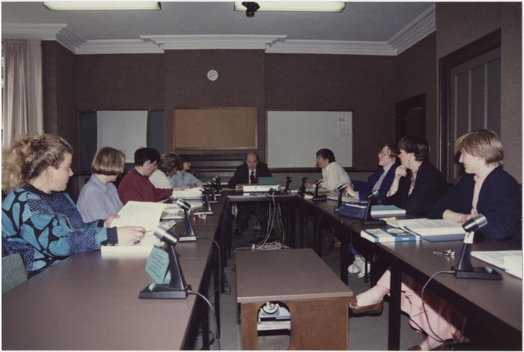 People using the University Extension conference room, 'Salmon (Jack) U.E. Teleconference Equipment'
