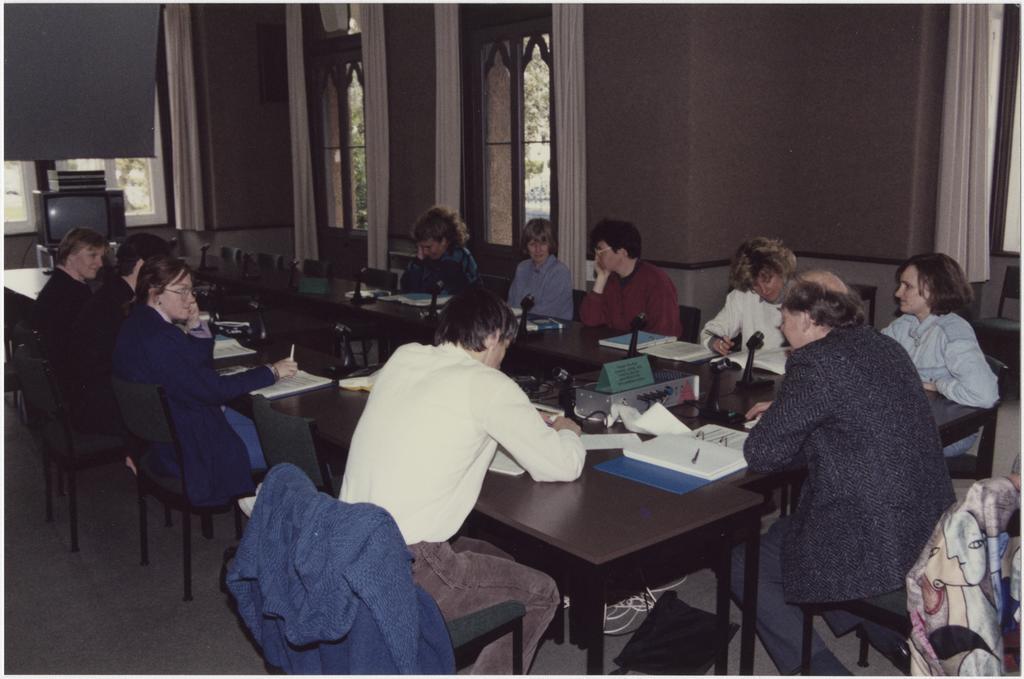 People using the University Extension conference room, 'Salmon (Jack) U.E. Teleconference Equipment'