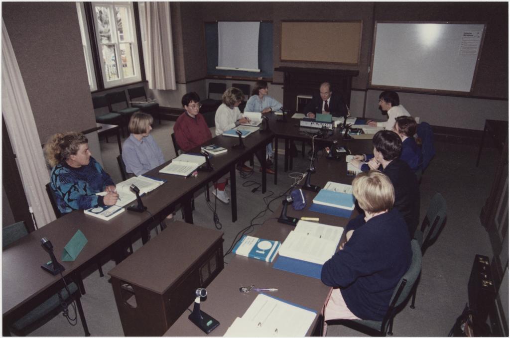 People using the University Extension conference room, 'Salmon (Jack) U.E. Teleconference Equipment'