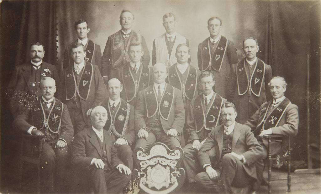 Group of men with shield, 'U.A.O.D. Royal Arch Chapter'