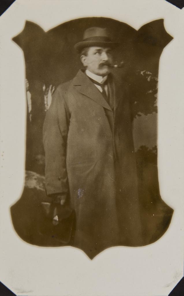 Man wearing overcoat and hat