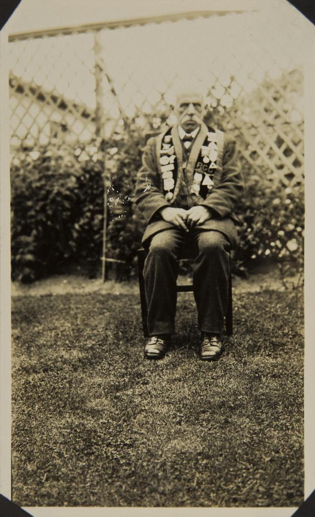 Man sitting in garden wearing druid regalia