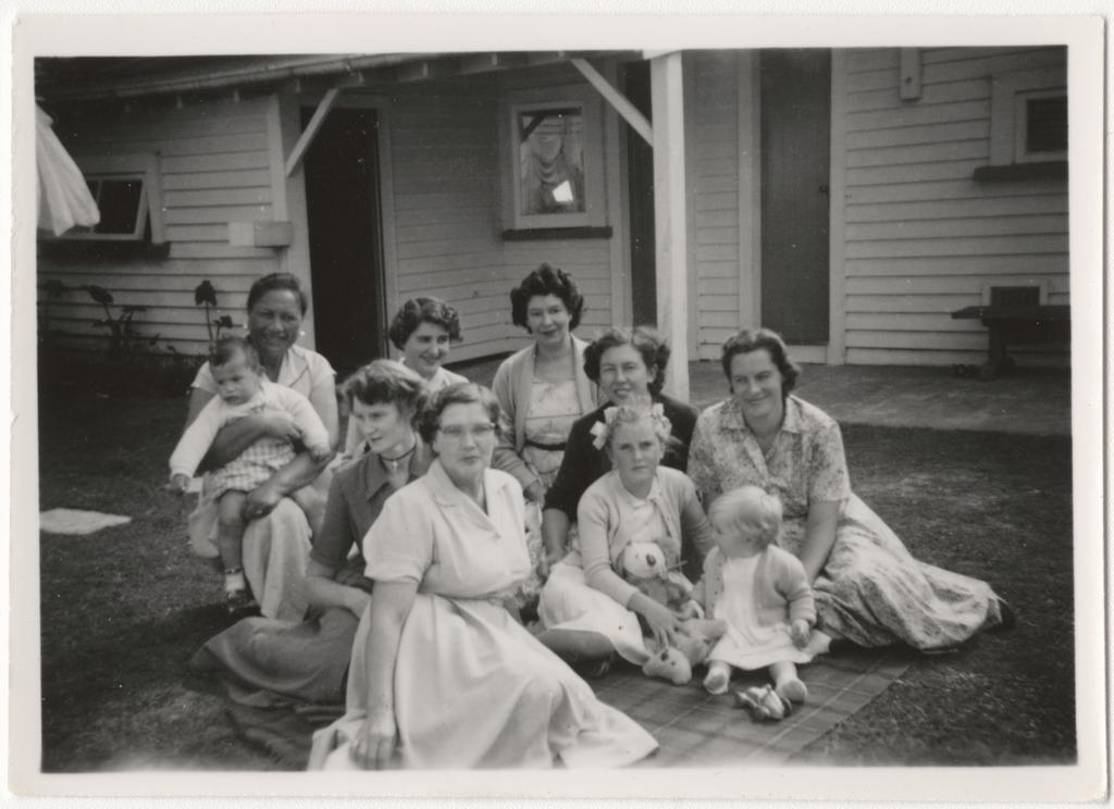 Mothers and babies in back garden, Bassam Hospital