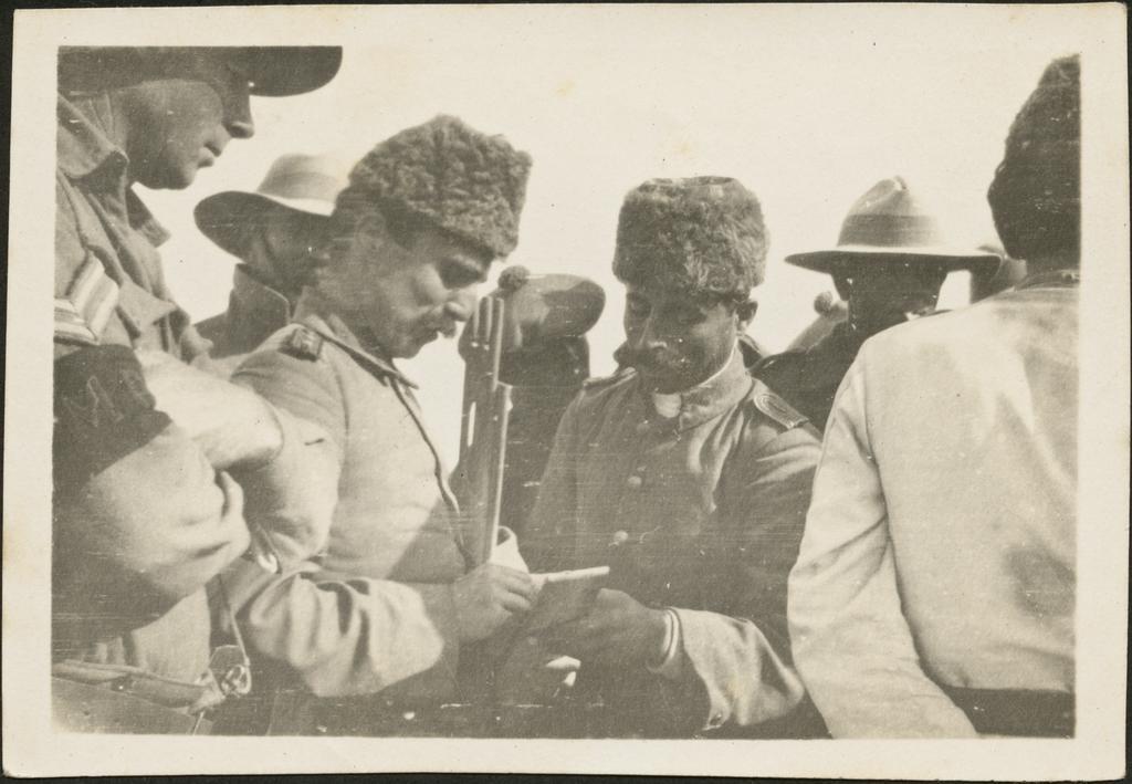 'Turkish officers captured at Magdhaba at [?] giving addresses and writing notes for transmission to Turks'