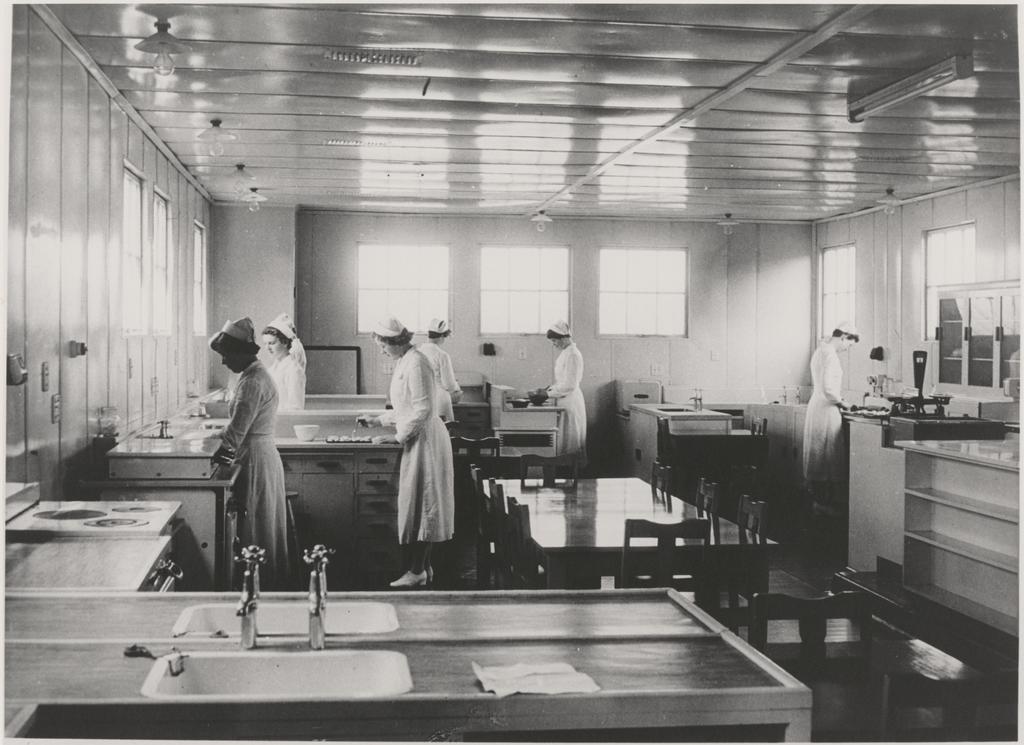 Six students working in kitchen