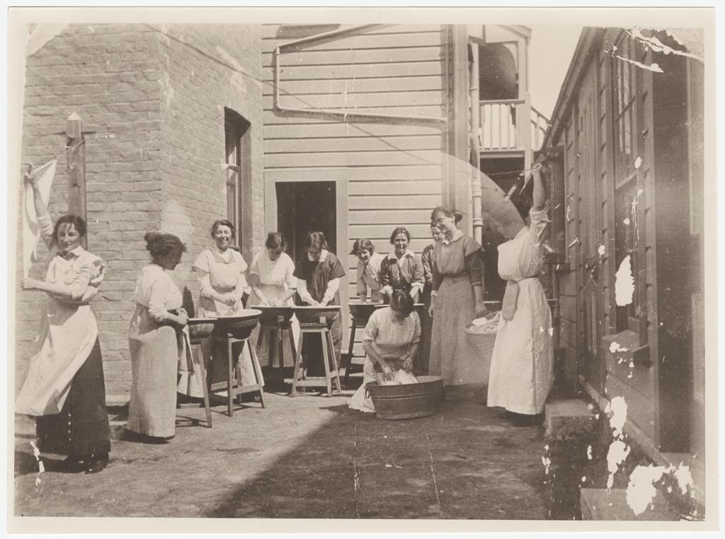 Laundry class being conducted at yard behind Studholme