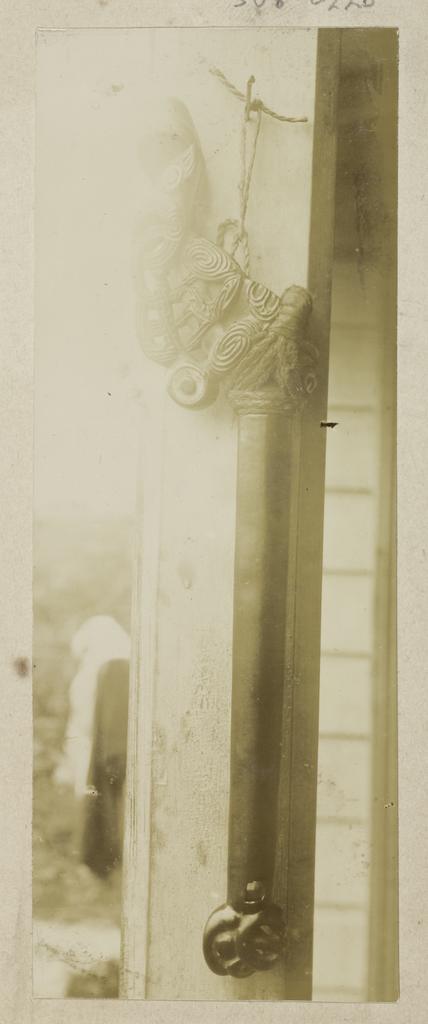 Carved handle of a stone adze or weapon
