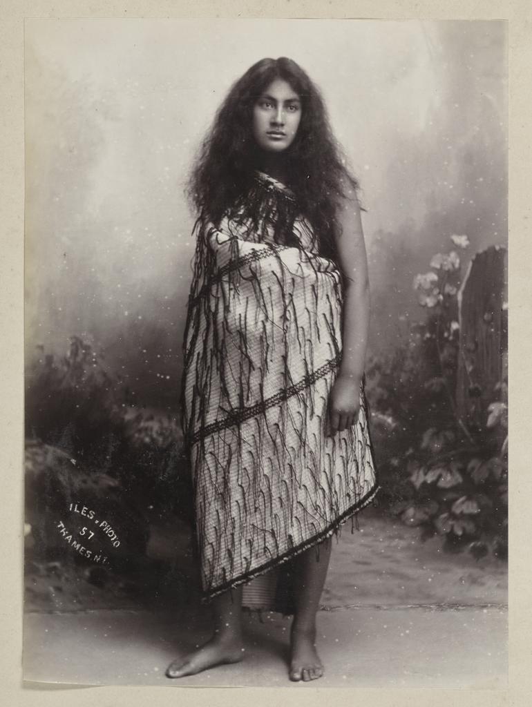 Untitled portrait of young Māori woman wearing a cloak