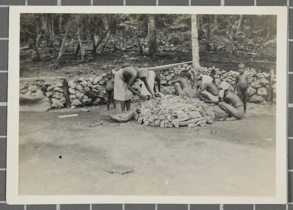 Nissan women building their cooking fire