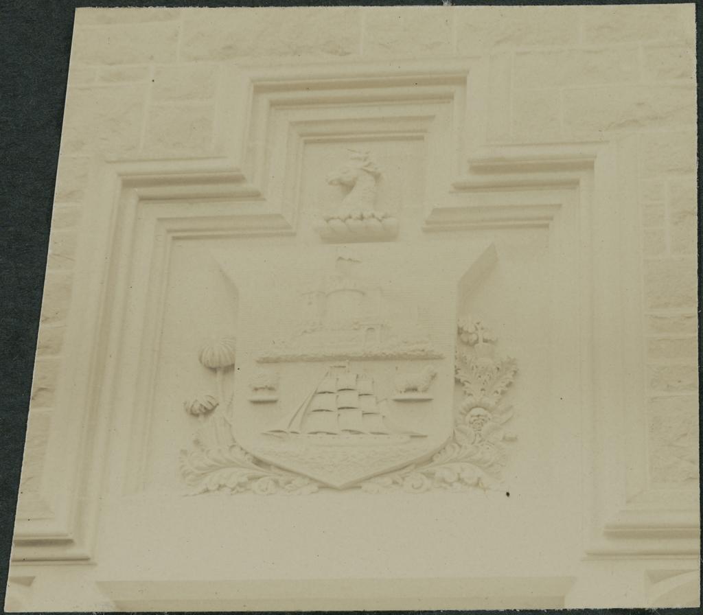 City crest over High School door